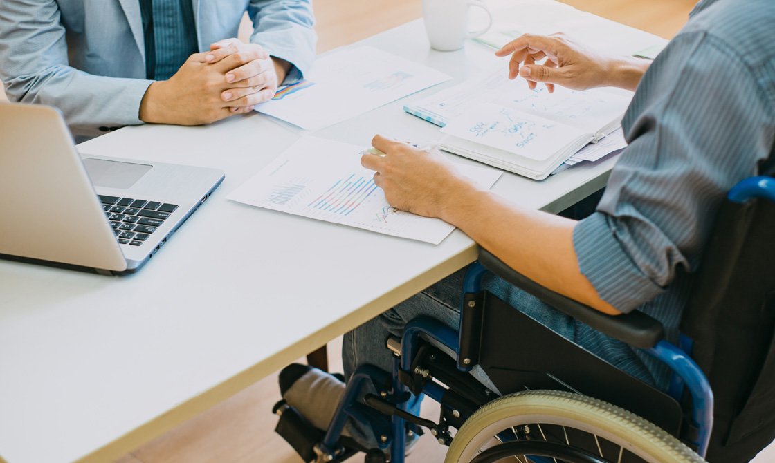 Close up of a man meeting with a personal injury lawyer