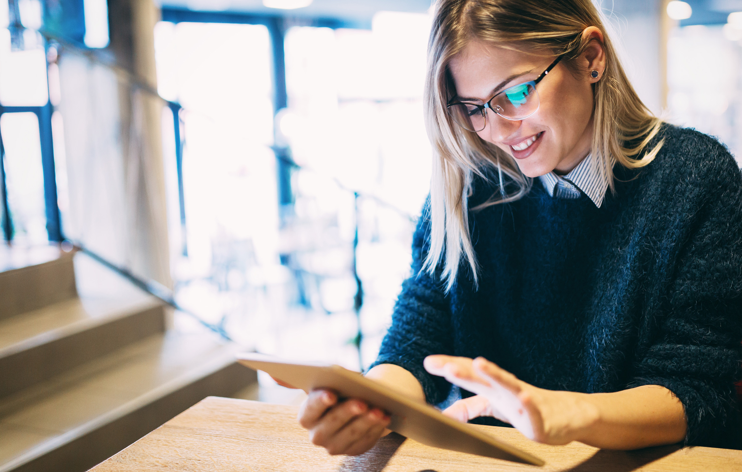Woman reading an ebook about personal injuries
