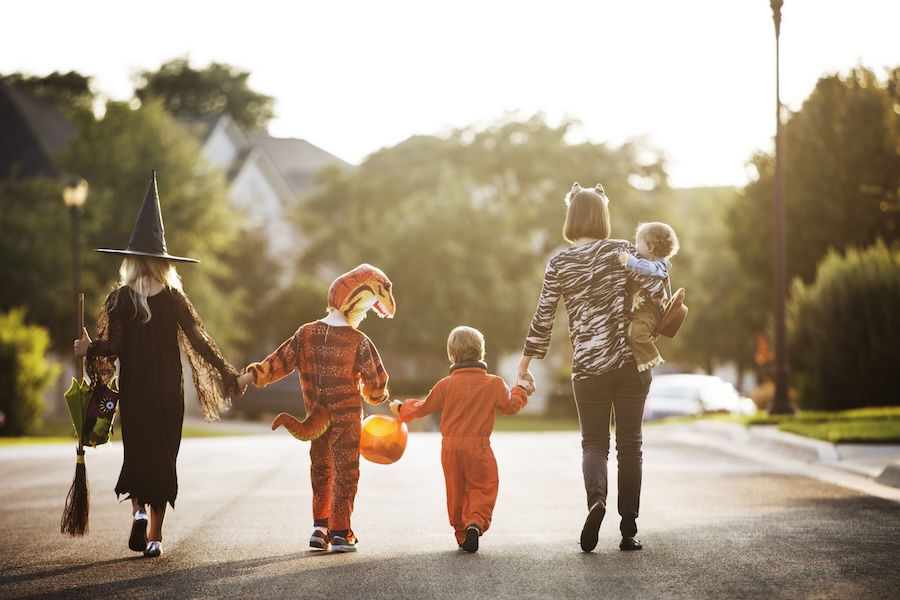 A family trick-or-treating in Joliet, Illinois.